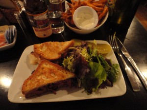 Freidman's pastrami sandwich and sweet potato fries